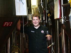 Graham With amid the forest of fermenters at Parallel 49 Brewing Company.