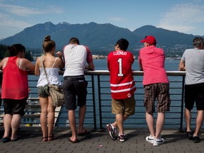 A guy wears a Roberto Luongo jersey on Canada Day in Vancouver, July 1, 2013. CP photo.