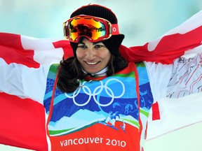 Canada's Maelle Ricker celebrates after winning Olympic gold in snowboard cross at the 2010 Winter Olympics in Vancouver. Getty Images file photo.