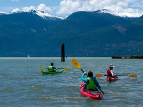 Kayakers take to the waters of Howe Sound after launching from a beach in Squamish on Saturday. One reader says more must be done to protect Canada's oceans. (Richard Lam/PNG)