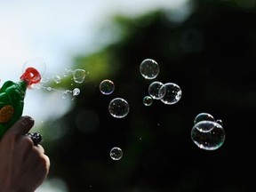 Bubbles are blown by a Pride parade participant. Gerry Kahrmann/PNG