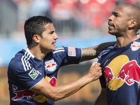 Tim Cahill and Thierry Henry of the New York Red Bulls. CP photo.