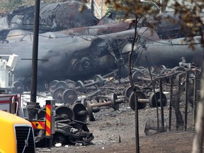 Wrecked oil tankers and debris from a runaway train that derailed and exploded in Lac-Megantic, Que., lies in a heap. The death toll could be as high as 60. (SURETE DU QUEBEC PHOTO)