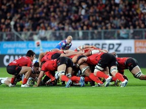 Toulon's players compete in a scrum during the French Top 14 rugby union match Grenoble (FCG) vs Toulon (RCT) on April 20, 2013 at the Stade des Alpes, in Grenoble, southeastern France.  JEAN-PIERRE CLATOT/AFP/Getty Images