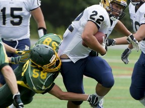 Brandon Ho (with ball) and the rest of the Rick Hansen Hurricanes, topped the host Windsor Dukes 33-6 Friday afternoon in North Vancouver. (PNG photo -- Jenelle Schneider)