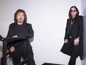 This June 6, 2013 photo shows singer Ozzy Osbourne, right, and musician Geezer Butler of the rock band Black Sabbath posing for a portrait in Los Angeles. (Photo by Dan Steinberg/Invision/AP)