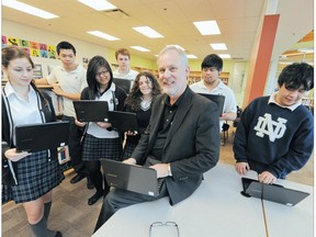 Teacher Peter Vogel with students at Notre Dame regional secondary school. (Photo by Glenn Baglo)