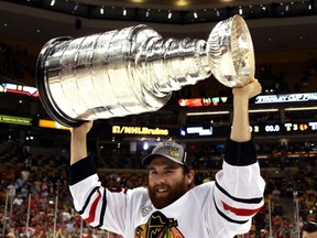 Ryan Stanton hoists the Stanley Cup after Chicago defeated the Boston Bruins in Game Six last June. The Canucks are hoping some of that rubs off after picking up Stanton off waivers on Monday.  (Photo by Bruce Bennett/Getty Images)