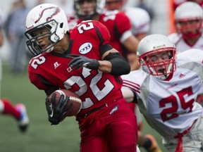 Carson Graham running back AJ Blackwell cut a determined swath through the Holy Cross defence Friday in North Vancouver. (Gerry Kahrmann, PNG)