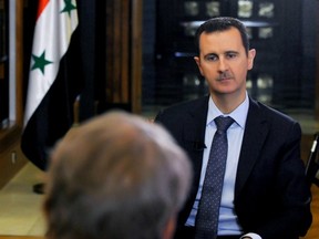 Syrian President Bashar Assad speaks with U.S. journalist Charlie Rose Monday about his government's alleged sarin chemical weapon attacks on rebels and potential U.S. retaliation. (ASSOCIATED PRESS)