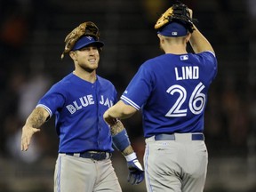 Brett Lawrie and Adam Lind of the Toronto Blue Jays.