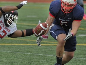 Simon Fraser Clan senior linebacker Casey Chin wears his heart on his inked right arm. (PNG file photo)