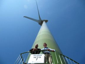Barry Penner and Blair Lekstrom, then B.C.’s environment and energy ministers, inspect a wind park near Dawson Creek in 2009, one of the projects many say are behind rapidly rising B.C. Hydro rates. (SUBMITTED PHOTO)