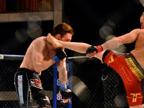 Newly signed Canadian UFC lightweight Jesse Ronson delivers a kick to the head of Ryan Healy in their fight at Score Fighting Series 7 in Hamilton, Ontario last November.