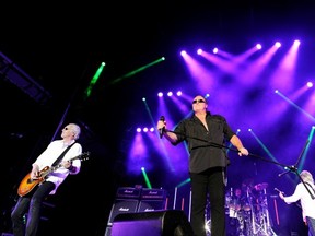 Loverboy's Mike Reno and guitarist Paul Dean give it their all during the final concert Monday night in a series of night concerts at the PNE that one reader says was too hard on neighbours. (Mark van Manen/PNG)