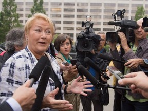 Quebec Premier Pauline Marois talks to reporters about a proposed Charter of Quebec values before a cabinet meeting on Wednesday. (THE CANADIAN PRESS FILES)