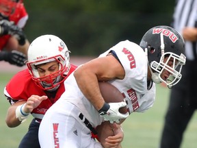 Simon Fraser linebacker Mitch Barnett, a former North Vancouver-Handsworth standout, puts the grips on Western Oregon Saturday at Fox Field. (Ron Hole, SFU athletics)