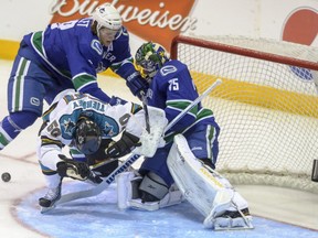 The Vancouver Canucks' Ludwig Blomstrand and Joacim Ericsson in action Sept. 5, 2013 against the San Jose Sharks. Ward Perrin, PNG photo.