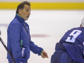 John Tortorella, head coach of the Vancouver Canucks, with forward Zack Kassian at training camp in September 2013. Ward Perrin -- PNG photo.