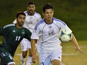 UBC's Sean Einarsson stays ahead of the visiting Fraser Valley Cascades on Friday during Canada West men's soccer action. (Wilson Wong, UBC athletics)