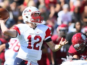 Simon Fraser quarterback Ryan Stanford launches the ball against the Central Washington defense Saturday at Tomlinson Stadium. (Photo courtesy Brian Myrick / Ellensburg Daily Record)