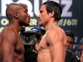 WBO welterweight champion Timothy Bradley (left) and Juan Manuel Marquez face-off at Friday's weight-in. Photo: Chris Farina, Top Rank