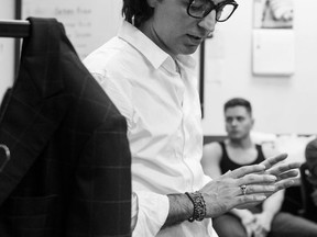 Valerio Moda designer Ali Mokhtarian backstage at Vancouver Fashion Week preparing to show his spring/summer collection.