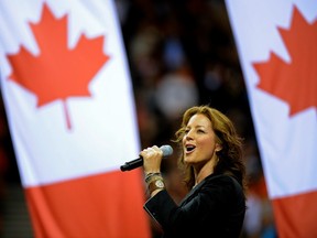 Canadian singer Sarah McLachlan belts out the national anthem at B.C. Place stadium in Vancouver in September 2011. (Les Bazso / PNG FILES)