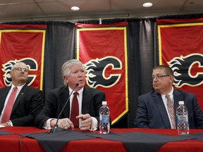 The Calgary Flames' Ken King, Brian Burke and Jay Feaster.