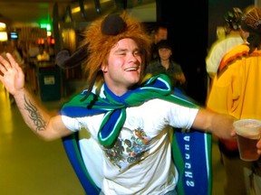Vancouver Canucks fan Tate Matkaluk enjoys a 2007 game against the San Jose Sharks. One reader says more liberal liquor rules would make the games and other events even more fun. (Gerry Kahrmann/PNG FILES)