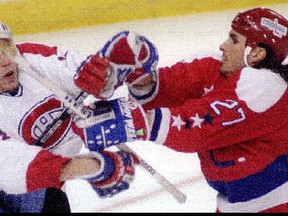 Back in the day, the Capitals' Craig Berube mixes it up with Montreal's Lyle Odelein. This was also apparently before the advent of quality photo reproduction.