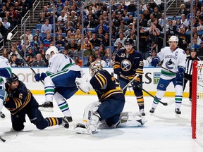 Henrik Sedin scored an assist on Canucks defenceman Ryan Stanton's first NHL goal Oct. 17, 2013 in Buffalo. Getty Images photo.