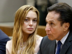 Actress Lindsay Lohan and attorney Mark Heller appear March 18 in Los Angeles Superior Court to determine if Lohan should be sent back to jail. (AFP FILES)