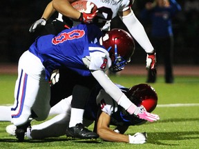 Rolling and rumbling, Terry Fox Ravens' running back Jericho Mendez rushed for three TDs Friday at Percy Perry Stadium (Photo -- ronhole.com)