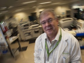 Dr. Mike Moss in his Burnaby lab. Moss is the co-writer of the new movie Decoding Annie Parker. (Arlen Redekop / PNG staff photo)