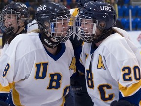 UBC Thunderbirds’ Christi Capozzi (right) celebrates with teammate Emily Grainger during the ‘Birds breakout 2012-13 Canada West season. Capozzi is back this season as team captain and UBC is ranked No. 10 in the CIS heading into Friday’s home opener. (Richard Lam/UBC athletics photo)
