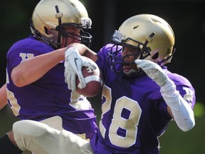 Vancouver College Grade 11 running back Ovie Odjegba (right) celebrates one of the three TDs he scored as the Irish beat No. 4 New Westminster on Saturday at O'Hagan. (Nick Procaylo, PNG photo)