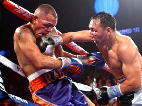 Ruslan Provodnikov lands flush with an over-hand right on Mike Alvarado on the way to dethroning the defending champion. Photo: Michael V. Ornelas/Rocky Mountain Boxing