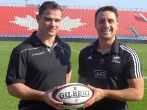 Canada rugby captain Aaron Carpenter (left) and New Zealand Maori All Blacks skipper Tim Bateman pose Wednesday, Oct.30, 2013 at BMO Field in Toronto, the site of their match Sunday.THE CANADIAN PRESS/Neil Davidson