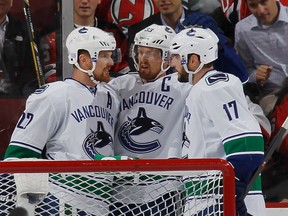 Henrik and Daniel Sedin, along with Ryan Kesler, of the Vancouver Canucks, are one of the NHL's hottest lines. Getty Images photo.
