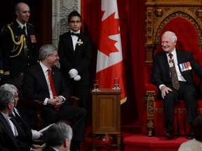 Gov.-Gen. David Johnston smiles as he speaks with Prime Minister Stephen Harper following the throne speech in the Senate Chamber on Parliament Hill in Ottawa on Oct. 16. (THE CANADIAN PRESS)
