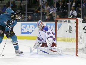 Tomas Hertl of the San Jose Sharks scores on the New York Rangers' Martin Biron on Oct. 8, 2013. Getty Images photo.