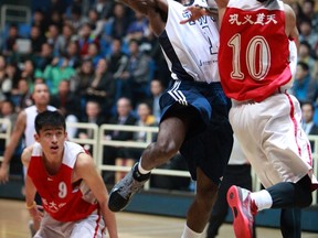 Trinity Western Spartans' guard Mark Perrin drives the paint against Tsinghua University during the team's three-game road trip through China earlier this month. Perrin and the Spartans open the Canada West basketball season Friday at the Langley Events Centre against the Calgary Dinos. (Scott Stewart/Trinity Western athletics)