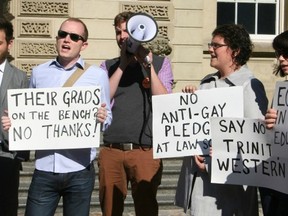 About 30 protesters opposed to Trinity Western University’s application to open a law school in Langley showed up outside Osgoode Hall in Toronto on Friday, Oct. 18. (PNG FILES)