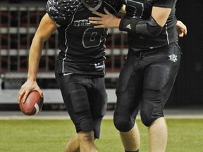 Mission senior Evan Horton (right) shares a moment in last season's Subway Bowl B.C. championship final with current UBC rookie Kevin Wiens. (PNG file photo)