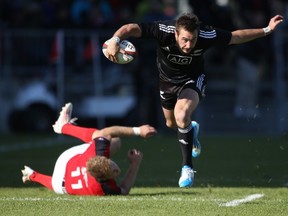 TORONTO, ON - NOVEMBER 3:  Andre Taylor #14 of the New Zealand Maori All Blacks breaks a tackle against Team Canada during the AIG Canada friendly game at BMO Field on November 3, 2013 in Toronto, Ontario, Canada. (Photo by Claus Andersen/Getty Images)
