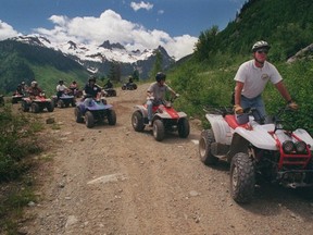 Mike Jakobsson, then operator of ATV Adventures, leads a tour through the beautiful backroads of Whistler in 1998. The B.C. government plans to bring in new fees and taxes on the recreational activity.  (Ric Ernst/PNG FILES)