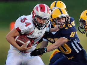 John Barsby running back Kyle Vollet (left) fends off South Delta's Mitch Dino. The two teams are a win away from meeting for the BC Double A title. (PNG file photo)