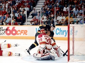 Remember this overtime classic? Flames fans could be forgiven for developing instant amnesia when it comes to this marker, the Canucks' Pavel Bure slipping the puck past Flames goalie Mike Vernon in double overtime in the seventh and deciding game of the 1993-94 Western Conference quarter-final at the Saddledome. Dean Bicknell/Calgary Herald. CALGARY HERALD ARCHIVE Neg # 0798  [PNG Merlin Archive]
