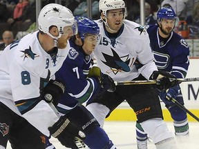 David Booth battles for position against the San Jose Sharks.